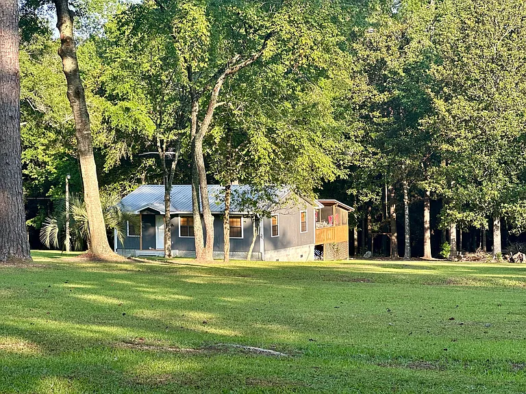 Large front yard. Lawn maintenance included with rent. Treed back yard with fire pit area.