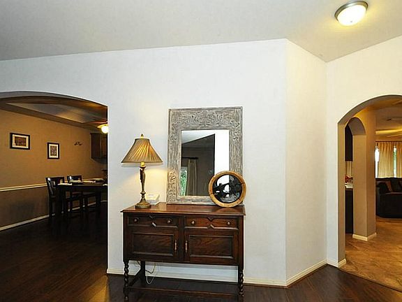 GRAND Entrance! Enjoy BOTH formals w/RICH laminate floors, HIGH 2 story Ceilings!