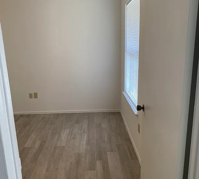 Light Grey Floor with fan and window view