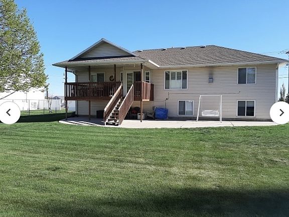 Back yard with deck and patio.
