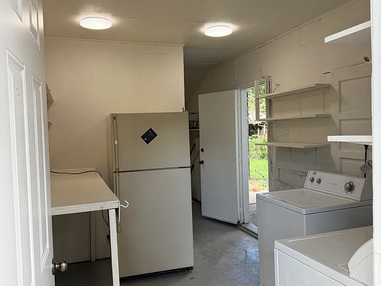 Attached outside accessible storage and laundry room. This rental comes with washer, dryer and additional refrigerator.