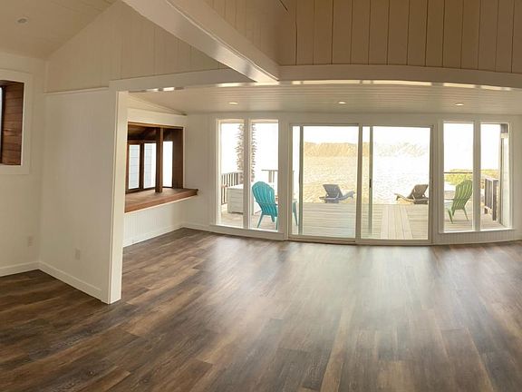 Spacious and bright living/dining all new floors, paint, light fixtures.