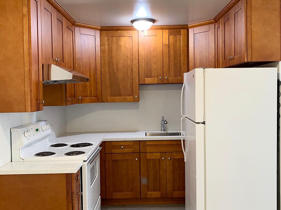 Remodeled kitchen w/new maple cabinets, new granite countertop, new sink. Stove is a few years old. Current pictured fridge will be replaced with a NEW (slightly smaller, less deep) fridge