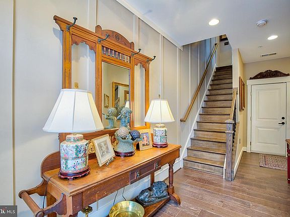 Foyer with custom oak stairs, & 7" hardwood floori