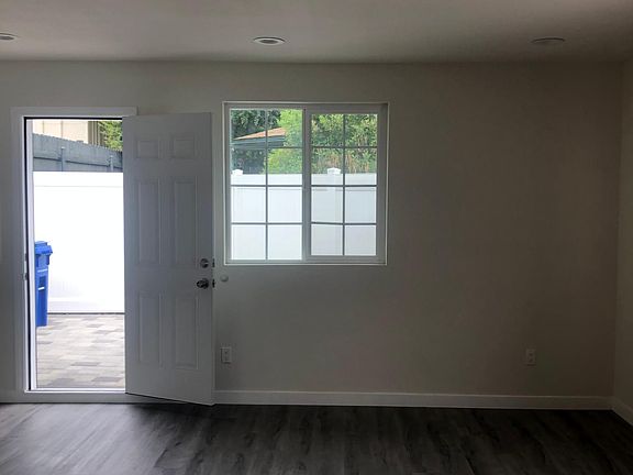 Different view of living room area looking out to the patio.