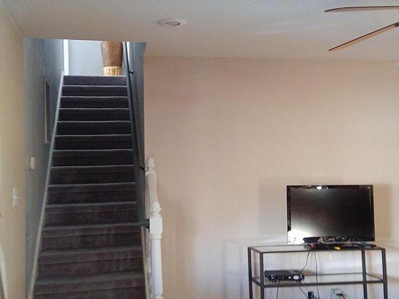 Living room and stairs to the master bedroom