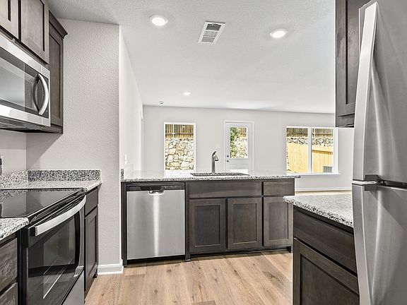 The kitchen has energy-efficient appliances.