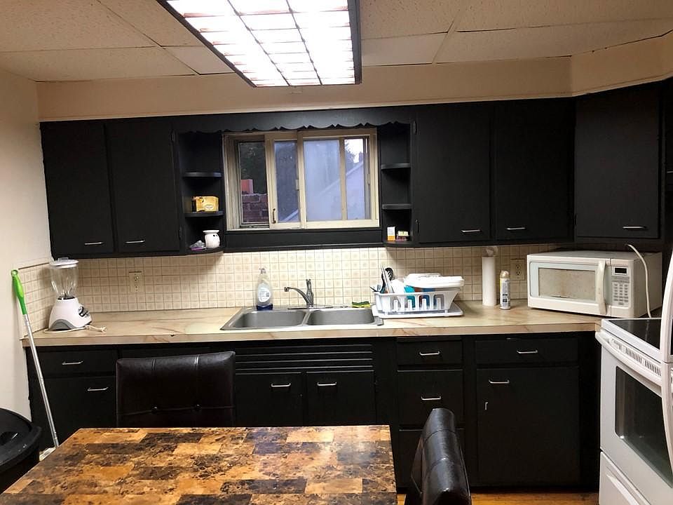 kitchen sink, cabinets, counter