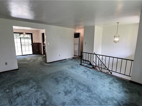 NICE SIZ LIVING ROOM OPEN TO DINING...AND PATIO DOORS TO YOUR PRIVATE DECK AND YARD!