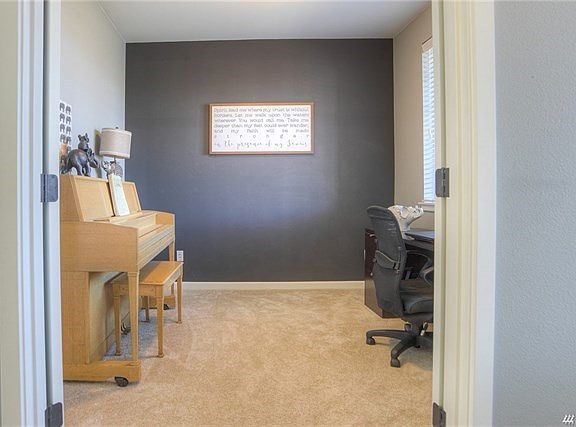 Another shot of the office. Notice the wonderful natural light and french doors for privacy when you are working from home.