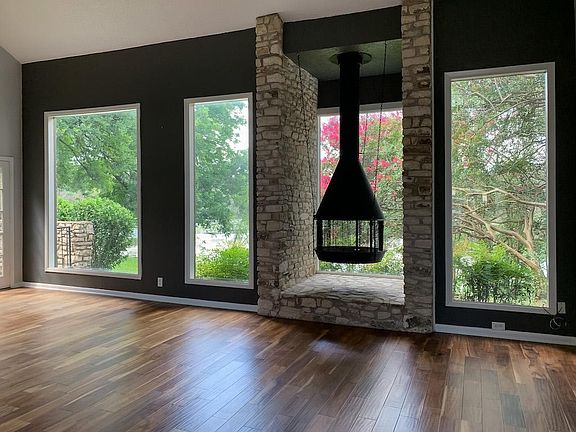 Mid century modern design brings the outside in dining & living room area