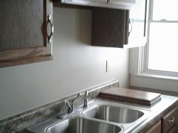 Nice kitchen with everything new. Back door.