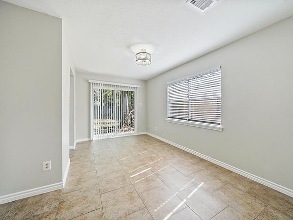 dining room leading to kitchen & backyard.