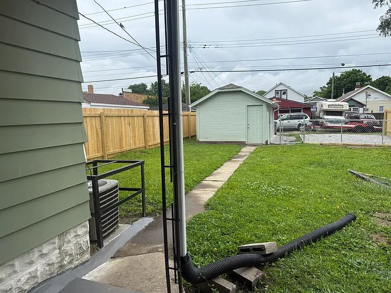Fenced back yard with 1 car garage and additional parking