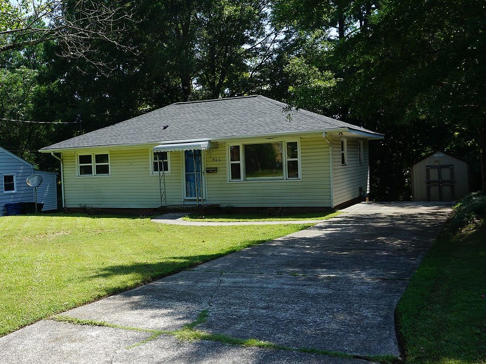 Front, driveway, storage building