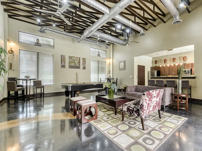 Loft Style Clubhouse Game Room equipped with pool table.
