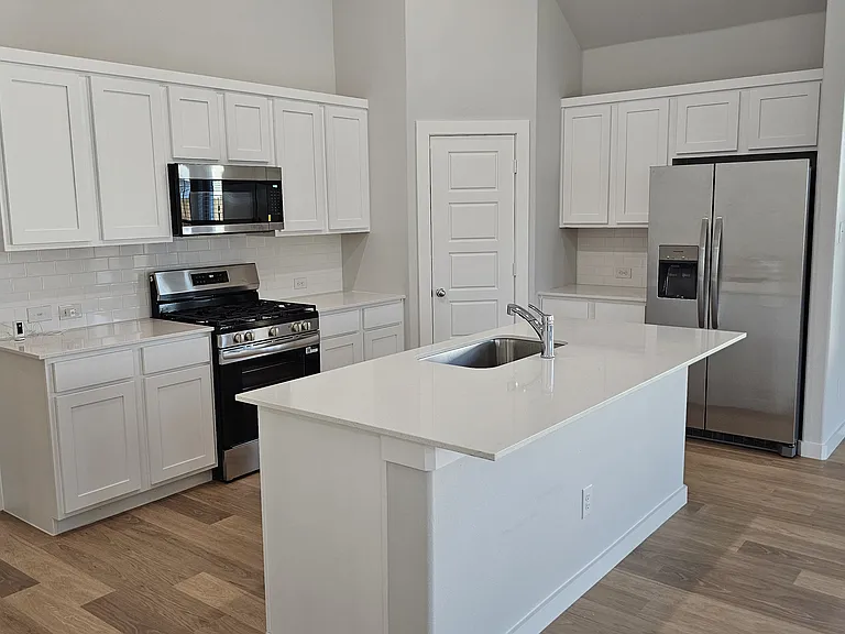 Plenty of counter space and high-end finishes make this kitchen both beautiful and functional