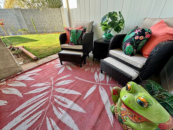 Comfy patio off of the master bedroom which is also attached to the landscaped yard.