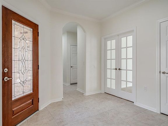 Grand entry that opens up in to your formal dining, kitchen and living area.