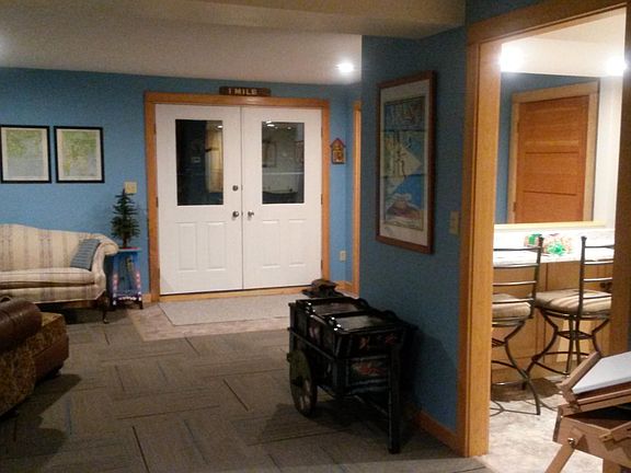 living room with door to backyard and river