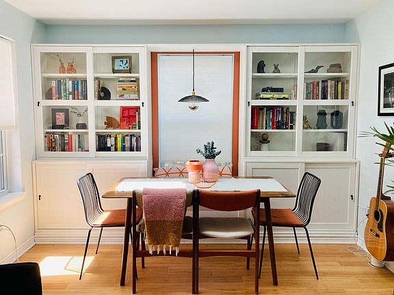 Close up of the living room / dining area. Built in bench & 4 chairs can comfortably accommodate 6 people. We also use it as a work space with the very comfy bench & lots of light.