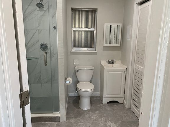 Entrance door from the main area to the bathroom.