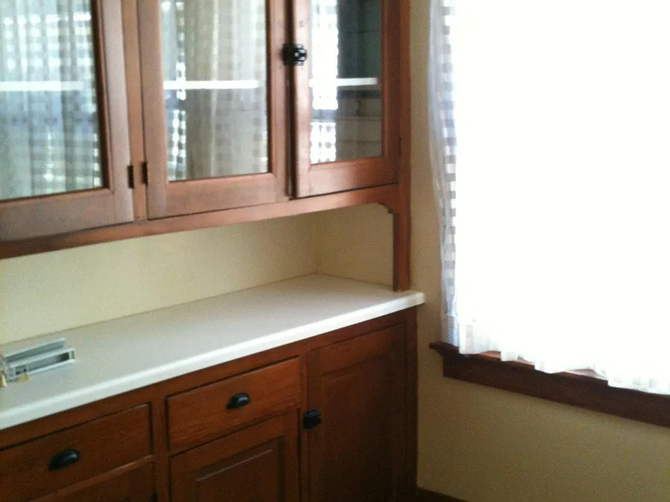 Kitchen includes many cabinets.