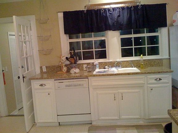 Kitchen, windows view carport.  Door goes to Master Bedroom