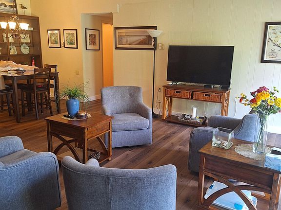 4 swivel rockering chairs with 50 in Smart television. Basic cable and internet are included.