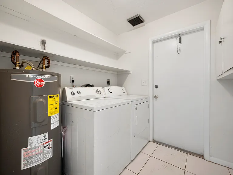Washer and dryer located in laundry room off the kitchen