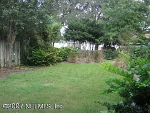 Back yard, water view through foliage