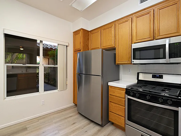 Oversized kitchen window for naturally light and fresh air.