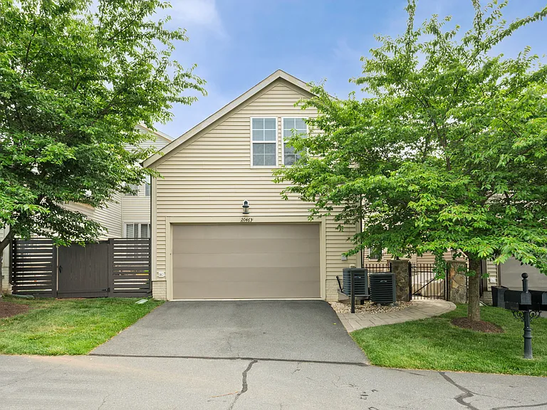 2 car attached garage with two car parking in the driveway on the back of the house.