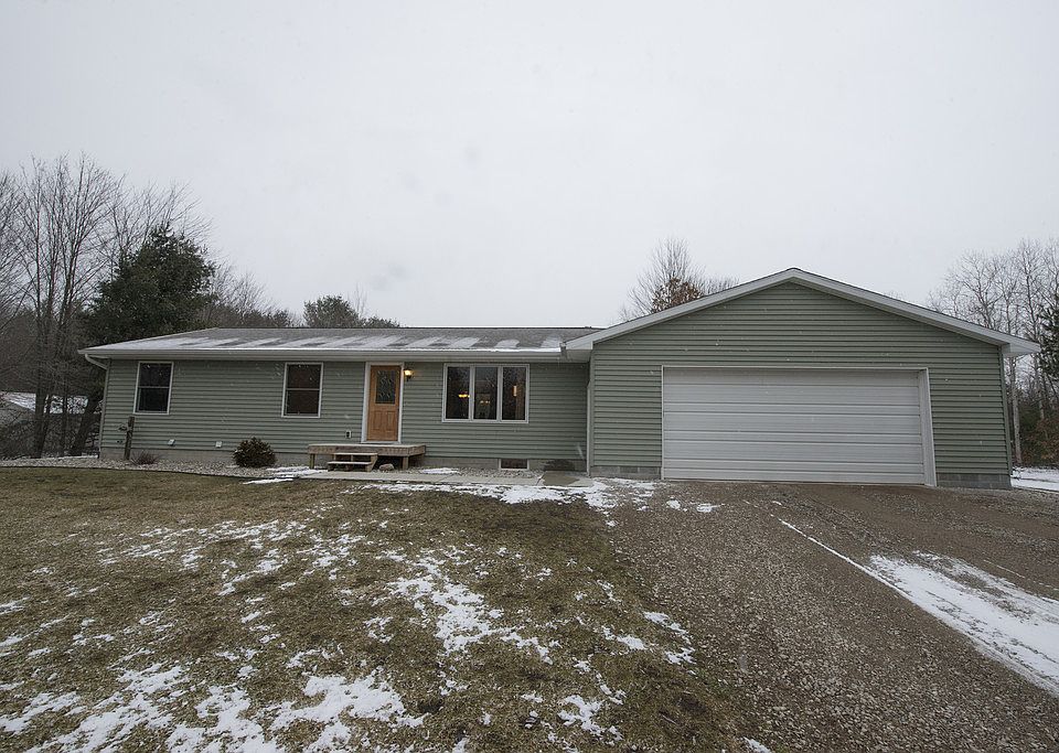 NICE AND NEAT ON NINE MILE! This three bedroom, two bathroom ranch style home built in 2005 nestled neatly on two acres features 1,232 square feet upstairs with a full, finished basement with wet bar and room for a fourth bedroom with egress, fenced yard, deck, central air, attached garage (28x34), city water with city water back up sump system, completely wired for a back up generator in the event of a power outage, neutral fresh paint, and more. The open concept main level features a master bedroom with walk-in closet, en suite and more. This home has been incredibly well cared for and is completely move-in ready. Don't wait, call today for your own private showing. 