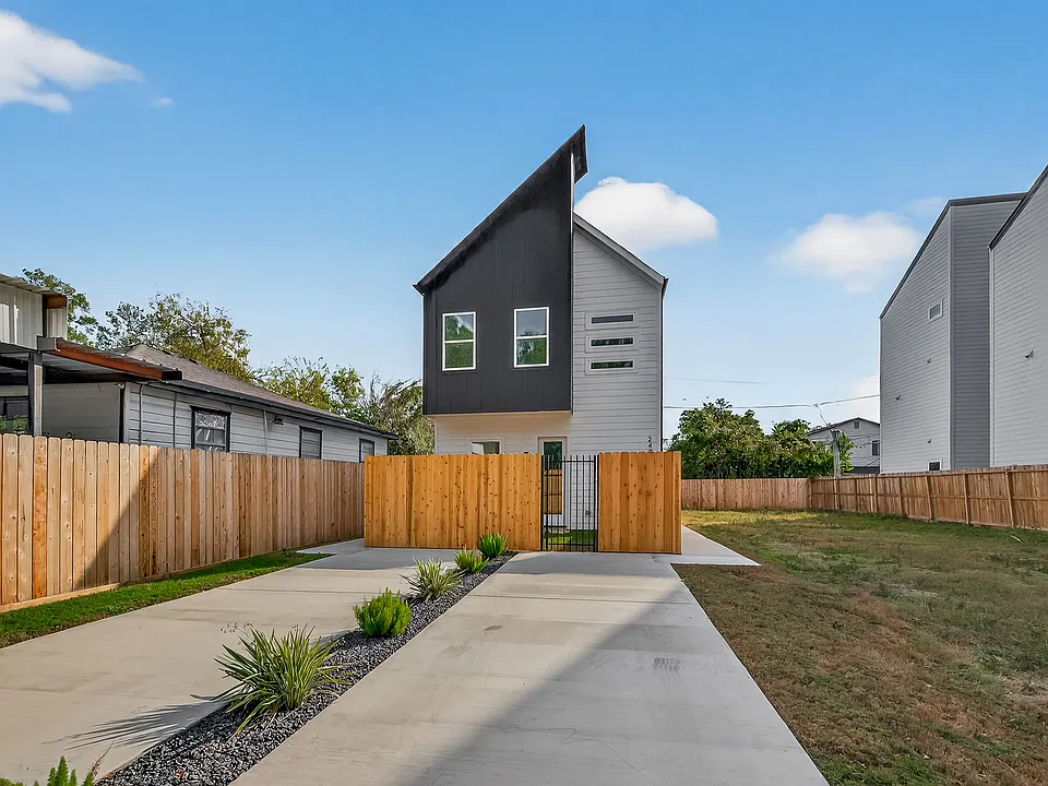 Brand new modern two-story home with dedicated driveway.