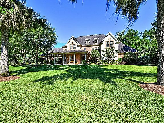 Does curb appeal get any better!! The home has a deep set back from the road! There are neighborhood stables at the front of the property for you to keep horses!