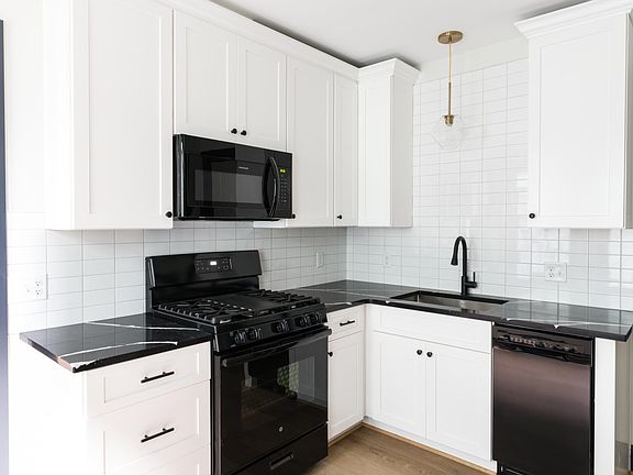 Kitchen. Quartz counters and full appliance package (including dishwasher).
