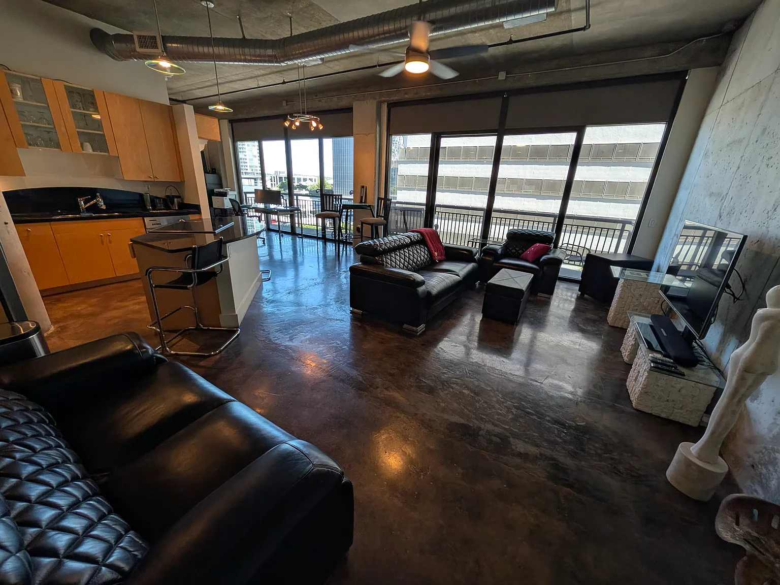 as you enter the living area is on the right, kitchen on the left with the bedroom around to left