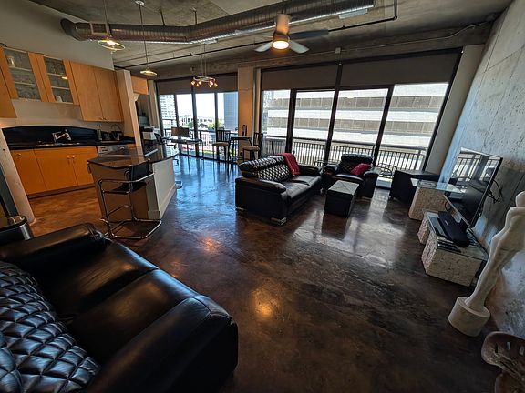 as you enter the living area is on the right, kitchen on the left with the bedroom around to left