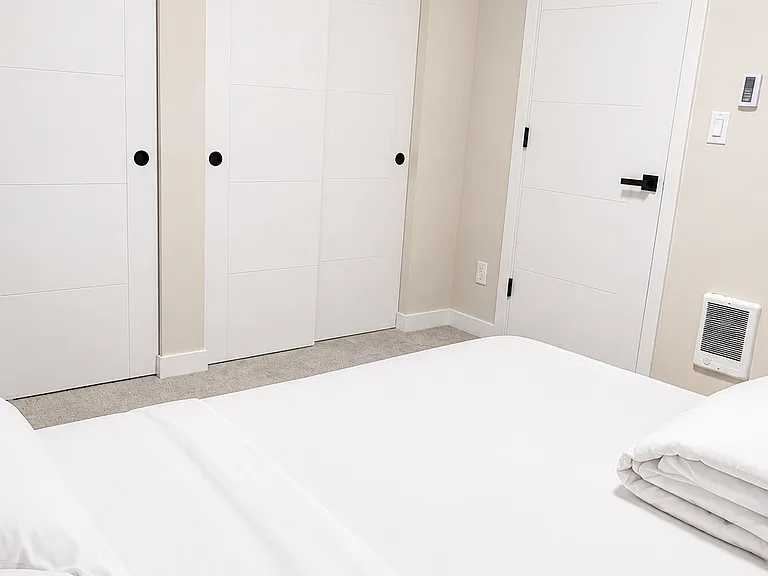 Second bedroom downstairs showcasing closet