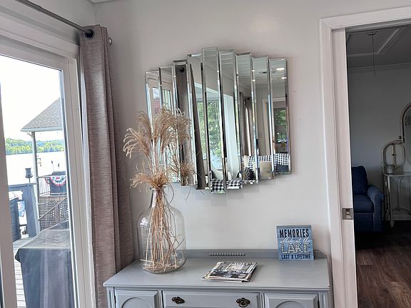 Antique table with mirror in living area.