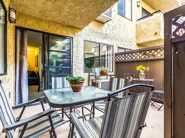 Private patio with bistro set and barbecue