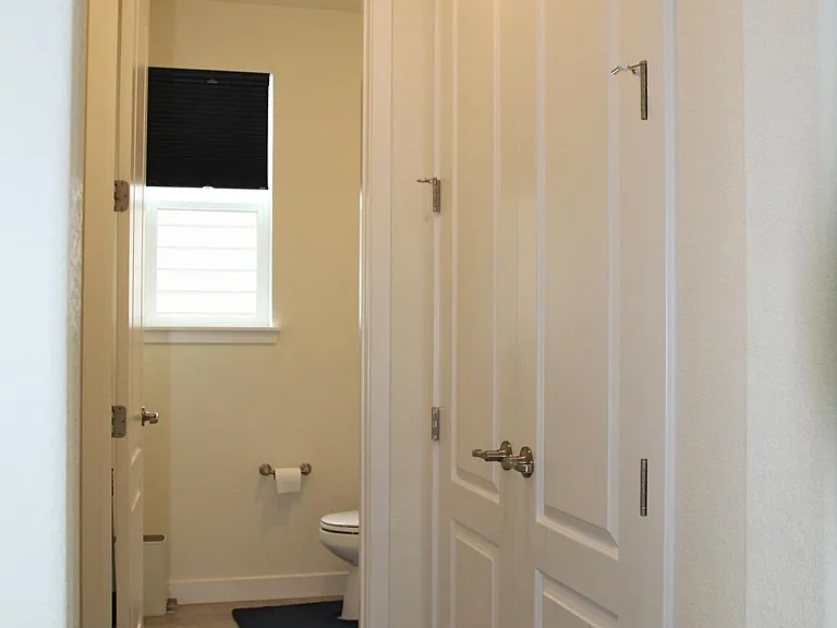 Main level powder is tucked away for the entertaining areas