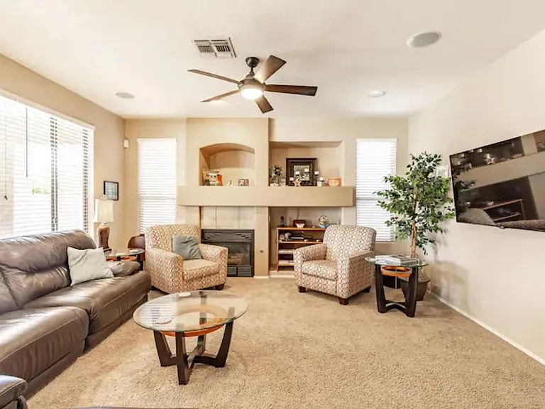 BIG leather couch, cozy chairs, fireplace and 60" Smart TV make this the perfect gathering space!