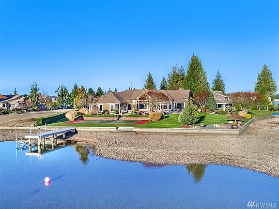 Another beautiful shot from the drone looking back from the SW side showing off the sport court, dock and lakeside yard. This si