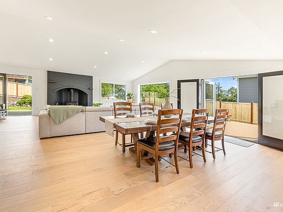 Wide plank, engineered Oak hardwoods throughout living room, hall, entry, kitchen>