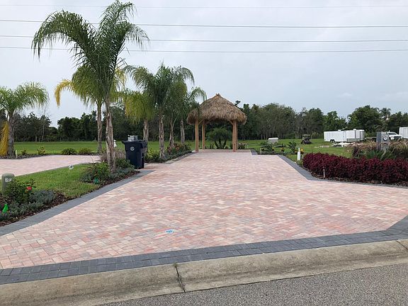 Large patio paver lot with water, sewer and 50/30 amp service. Large covered Tiki Hut!