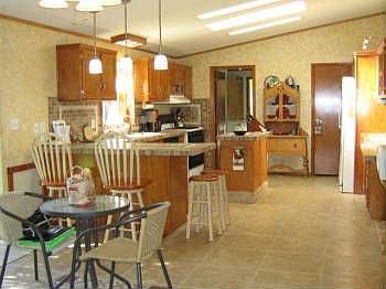Large Bright Kitchen with Skylite and walk-out to deck