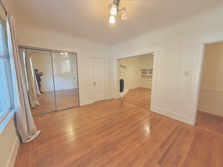 Bedroom to living room with pocket door open