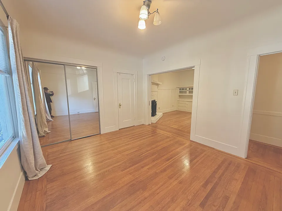 Bedroom to living room with pocket door open